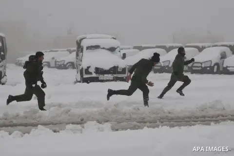 Palestinian security personnel engage in a snowball fight near their headquarters in the West Bank city of Hebron 10 January 2013. The higher elevations in the Palestinian Authority areas and Israel, including Jerusalem,...