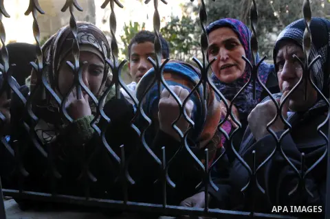 Palestinian relatives of Uday Kamil Muhammad Darwish aged 21, mourn during his funeral in the village of Dura, south of the West Bank city of Hebron, 13 January 2013. Reports state that Israeli forces shot dead Uday Kami...