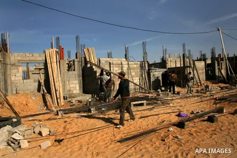Palestinians work at a construction site in Rafah in the southern Gaza Strip on Jan. 16, 2013. Israel allowed the entry of gravels into the Gaza Strip on Dec. 30, 2012 for the first time since it imposed a tight blockade...