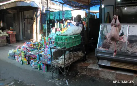 A Palestinian vendor sells cleaners at al-Zawiya popular market in Gaza city, January 20, 2013. Photo by Ezz al-Zanoon
