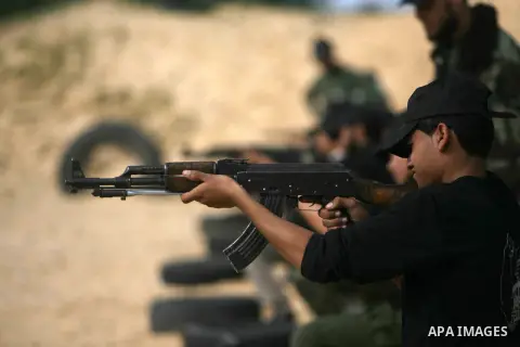 Palestinian youths display their skills during scouts training in Rafah southern Gaza strip, on January 23, 2013. Palestinian ministry of education and higher education organized a camp to train Palestinian boy scouts fo...
