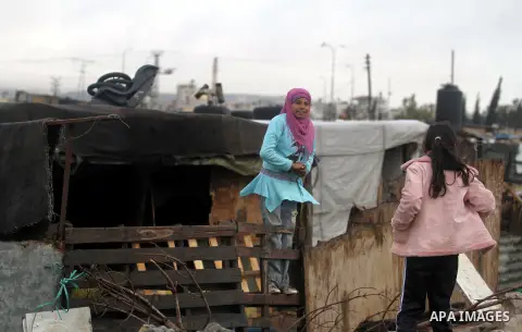 Palestinian Bedouin women stand next their tents in the village of Jaba' southern the West Bank city of Ramallah on Jan. 31, 2013. Israeli forces handed notices ordering the demolition of 16 houses in the village of Jaba...