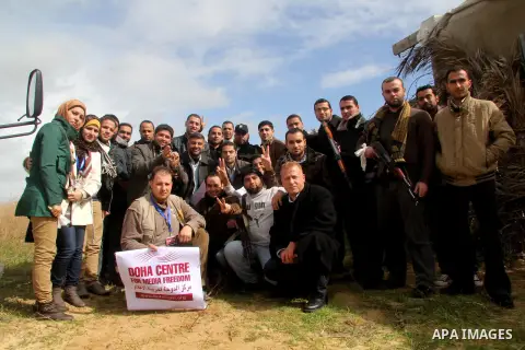 Palestinian journalists pose for the camera during a training course for the work safety in covering the wars, in Gaza city on Jan. 31, 2013. Many journalists participate in the first of its kind course in Gaza strip org...