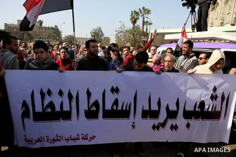 Egyptian protesters take part in a demonstration calling for Islamist President Mohamed Morsi to step down outside the al-Noor Mosque, in Cairo on February 8, 2013. Thousands took to the streets after opposition groups c...
