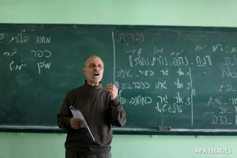 A Palestinian teacher teaches Hebrew to ninth grade students at a Gaza school in Gaza City Feb. 20, 2013. Hamas, which controls the Gaza Strip began this year to teach Hebrew to school students from the ninth grade. Phot...