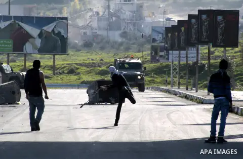 Palestinian demonstrators throw stones at Israeli border police during clashes at Huwwara checkpoint near Nablus, the West Bank, 21 February 2013. According to Palestinian sources, 12 Palestinians were injured during the...