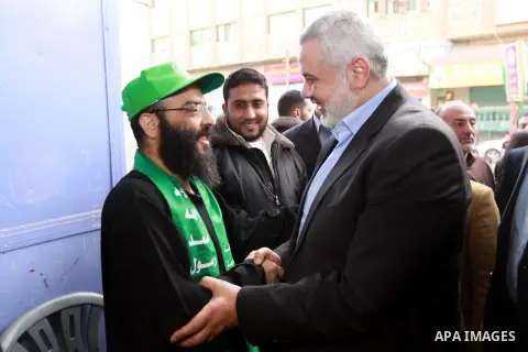 Palestinian Prime Minister in Gaza strip Ismail Haniyeh visits the former Palestinian prisoner Akram Rikhawi in the southern Gaza strip city of Rafah on February 22, 2013. Rikhawi from Gaza was arrested by Israeli occupa...