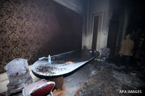 A picture shows the charred remains of Egyptian laywer Ayman Nur's office, chairman of the Ghad El-Thawra Party, after members of the Black Bloc group torched his office in downtown Cairo on February 22, 2013. Photo by T...