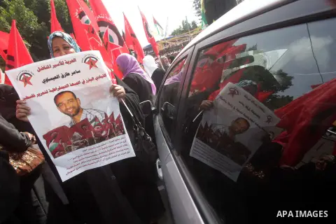 Supporters of the Palestinian Democratic Front protest in solidarity with Palestinian prisoners held in Israeli jails in Gaza city on Feb. 23, 2013. The demonstration was held in solidarity with Palestinian prisoner Same...
