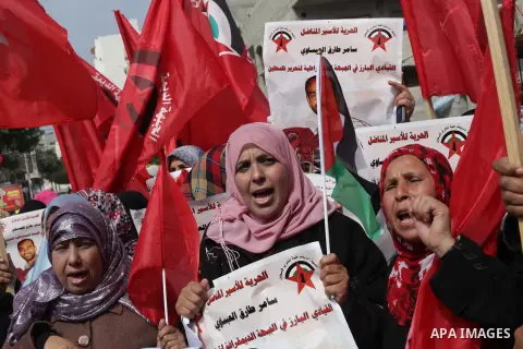 Supporters of the Palestinian Democratic Front protest in solidarity with Palestinian prisoners held in Israeli jails in Gaza city on Feb. 23, 2013. The demonstration was held in solidarity with Palestinian prisoner Same...