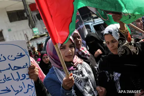 Palestinians take part in a protest against the death of a Palestinian detainee in an Israeli jail, in Gaza City February 24, 2013. Palestinian officials on Saturday demanded an international investigation into the death...