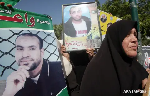 Palestinian women take part in a protest against the death of a Palestinian detainee in an Israeli jail, in Gaza City February 24, 2013. Palestinian officials on Saturday demanded an international investigation into the...