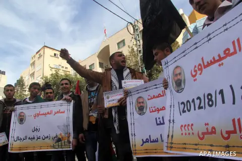 Palestinians take part in a protest against the death of a Palestinian detainee in an Israeli jail, in Gaza City February 25, 2013. Palestinian officials on Saturday demanded an international investigation into the death...