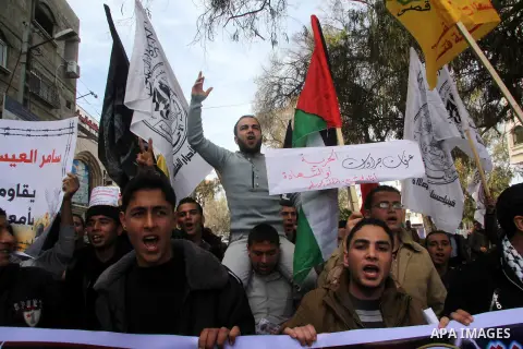Palestinians take part in a protest against the death of a Palestinian detainee in an Israeli jail, in Gaza City February 25, 2013. Palestinian officials on Saturday demanded an international investigation into the death...