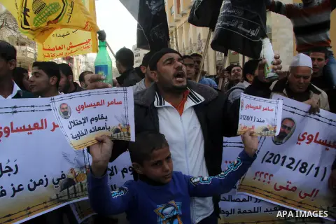 Palestinians take part in a protest against the death of a Palestinian detainee in an Israeli jail, in Gaza City February 25, 2013. Palestinian officials on Saturday demanded an international investigation into the death...