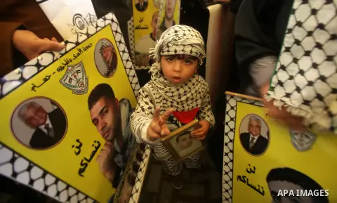 Palestinians take part in a protest against the death of a Palestinian detainee in an Israeli jail, in Gaza City February 25, 2013. Palestinian officials on Saturday demanded an international investigation into the death...