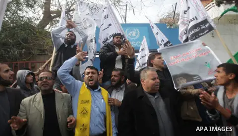 Palestinians take part in a protest against the death of a Palestinian detainee in an Israeli jail, in front of the headquarters of the United Nations in Gaza City February 25, 2013. Palestinian officials on Saturday dem...