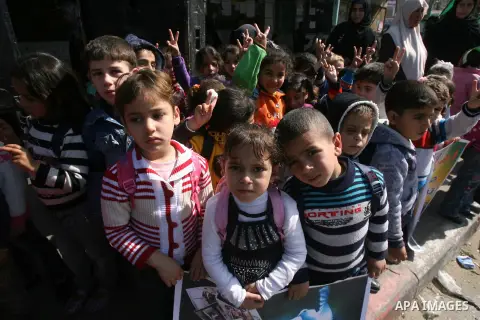 Palestinian children take part in a protest against the death of a Palestinian detainee in an Israeli jail, in Rafah city in the southern Gaza Strip on Feb. 27, 2013. Palestinian officials on Saturday demanded an interna...