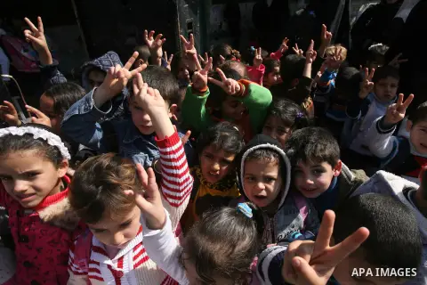 Palestinian children take part in a protest against the death of a Palestinian detainee in an Israeli jail, in Rafah city in the southern Gaza Strip on Feb. 27, 2013. Palestinian officials on Saturday demanded an interna...