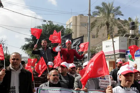 Demonstrators from the Palestinian factions take part in a protest against the death of a Palestinian detainee in an Israeli jail, in front of the Erez crossing into Israel near the northern Gaza Strip town of Beit Hanun...