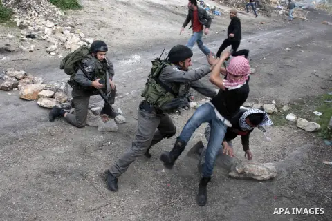 Israeli soldiers arrest Palestinian protesters during clashes following the weekly protest against the Jewish settlement of Qadumem, near the West Bank city of Nablus, 01 March 2013. 10 Palestinians were wounded and anot...