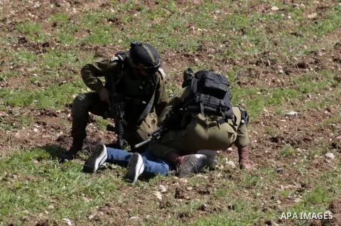 Israeli border police officers detain a Palestinian youth after he threw stones during clashes at Hawara checkpoint near the West Bank city of Nablus March 2, 2013. The death of a Palestinian prisoner in disputed circums...
