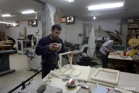 Deaf Palestinian men work on joinery at Atfaluna Society for Deaf Children in Gaza City, on 6 March, 2013. The society provides services for about 15,000 deaf children and adults on education, training programs and incom...