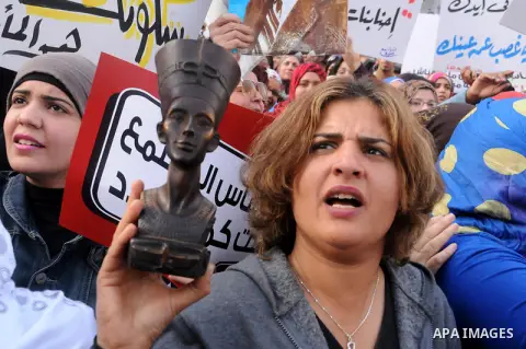 Egyptian women chant slogans as they march in downtown Cairo to mark International Women's Day on March 8, 2013. Faced with a spike in sexual violence against female protesters, Egyptian women are overcoming stigma and r...
