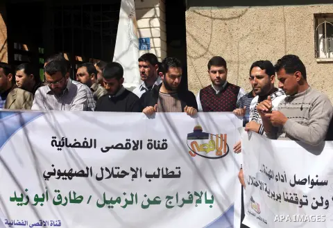 Palestinian journalists attend a protest against arrests of the Journalist Tareq Abu Zaid Al-Aqsa TV reporter by the security forces in the West Bank, Gaza City on March. 10, 2010. Photo by Ashraf Amra
