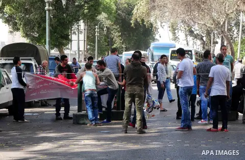 Egyptian protesters from Boulak close Nile corniche road during a protest in front of the Egyptian Radio and Television Union, in Cairo on march 12, 2013. Protesters demanded dismissal of the governor of Cairo and the De...
