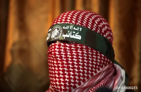 Abu Obeida, Ezzedine al-Qassam Brigades spokesman the military wing of Hamas movement, speaks during a press conference in Gaza city on March 14, 2013. al-Qassam Brigades announced that it would sue the Egyptian newspape...