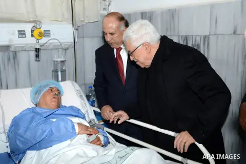 Palestinian President Mahmoud Abbas visits the wounded pilgrims in the hospital of Salt, in Amman on March 17, 2013. Fifteen Palestinians returning from a minor pilgrimage in Saudi Arabia were killed and 38 others were i...