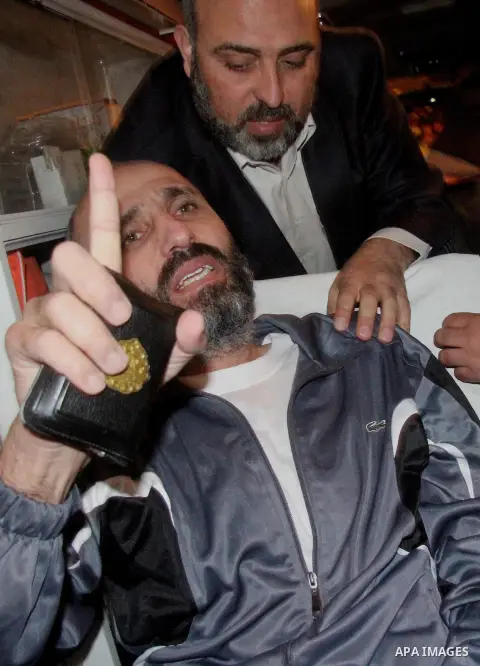 Palestinian former prisoner Ayman Sharawna lays on a bed in an ambulance following his release in Gaza city on March 17, 2013. The 36-year-old Ayman Sharawna arrived to Gaza after more than eight months on hunger strike,...