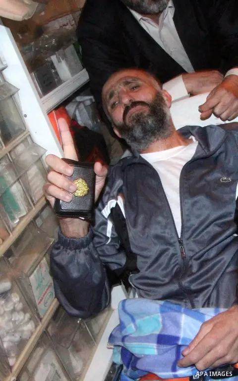 Palestinian former prisoner Ayman Sharawna lays on a bed in an ambulance following his release in Gaza city on March 17, 2013. The 36-year-old Ayman Sharawna arrived to Gaza after more than eight months on hunger strike,...