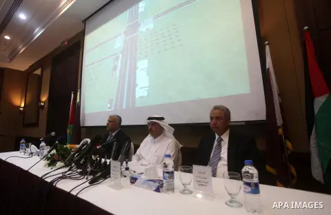 Palestinian Minister of Works and Housing in Gaza strip Yousef al-Ghrez, and Qatari ambassador Mohammed al-Emadi attend the signing ceremony of agreement to start building the project of Hamad ben Khalifa city and recons...