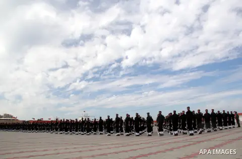 Members of Palestinian security forces take part in a graduation ceremony in Gaza City March 19, 2013. Photo by Ezz al-Zanoon