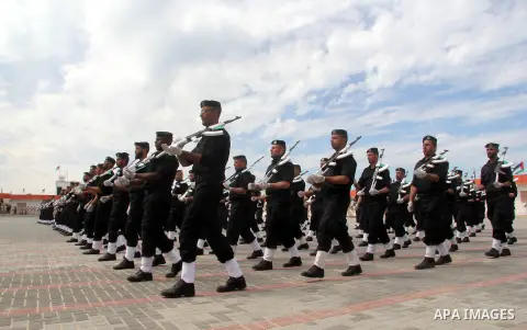 Members of Palestinian security forces take part in a graduation ceremony in Gaza City March 19, 2013. Photo by Ezz al-Zanoon