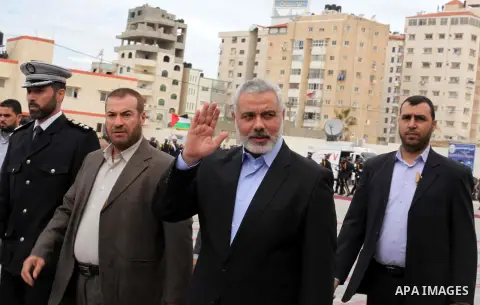 Palestinian Prime Minister in Gaza strip Ismail Haniyeh takes part in a police graduation ceremony at a police academy in Gaza City March 19, 2013. Photo by Ashraf Amra