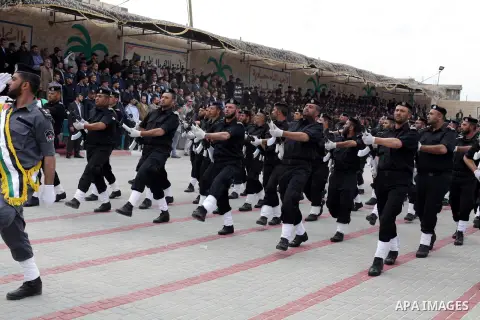 Members of Palestinian security forces take part in a graduation ceremony at a police academy in Gaza City March 19, 2013. Photo by Ashraf Amra