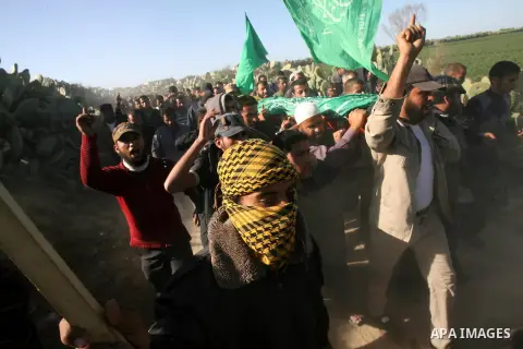 Palestinian mourners take part in the funeral of bassam El-Amor 24 years in Fukhari neighborhood east of Khan Younis in the southern Gaza Strip, on March 24, 2013. Israeli army delivered the body of Amour after booked 4...