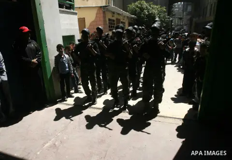 Palestinian students take part in a military-style graduation ceremony in Rafah in the southern Gaza Strip March 28, 2013. The military-style exercise in the 138 Hamas-run high schools in Gaza was part of a program sanct...