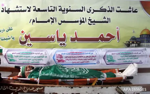 The body of Ezz Eddin al-Qassam brigades member, the military wing of Hamas movement, Mohammed al-Serhi, 20, lays on a coffin during his funeral in Gaza city on March 28, 2013. Two members of Al-Qassam brigades injured a...