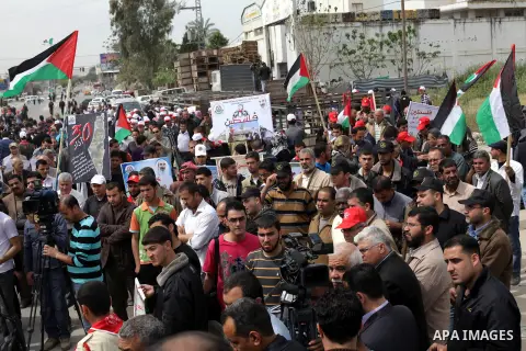 Palestinians take part in a rally marking Land Day in Beit Hanun in the northern Gaza Strip on March 30, 2013. Land Day commemorates the death of six Arab Israeli protesters at the hands of Israeli troops during mass pro...