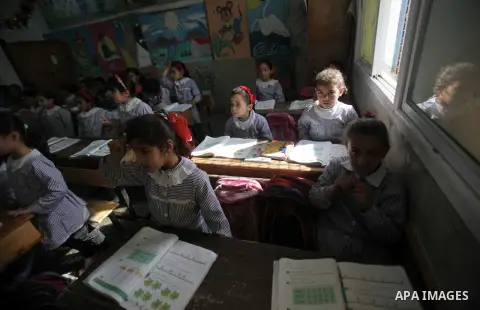 Palestinian school children take part in a class at a United Nations-run school in Deir Balah in central Gaza Strip April 2, 2013. New rules from the Education Ministry of the Islamist Hamas movement ruling the Gaza Stri...