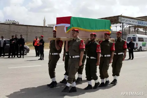Palestinian Polices take part in a military funeral for palestinian prisoner Maisara Abu Hamdiyeh, in Gaza city on April 4, 2013, who was suffering from throat cancer and died at Soroka hospital in the southern Israeli c...