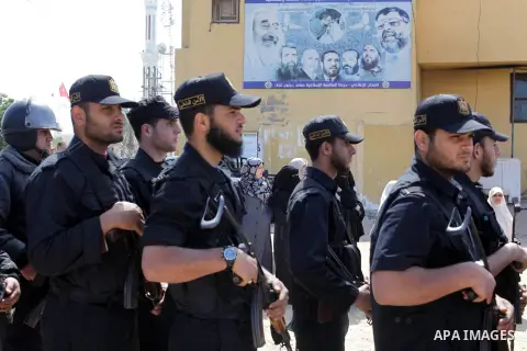 Palestinian Polices take part in a military funeral for palestinian prisoner Maisara Abu Hamdiyeh, in Gaza city on April 4, 2013, who was suffering from throat cancer and died at Soroka hospital in the southern Israeli c...