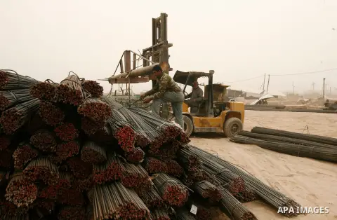 A forklift truck is seen carries ribbed construction iron bars following smuggled through a smuggling tunnel between the Hamas-ruled Gaza Strip and Egypt in the southern Gaza Strip city of Rafah on April 4, 2013. The Egy...