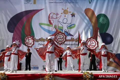 Palestinian children take part in a celebration to mark the International Children Day in Gaza city on April, 07, 2012. Photo by Mohammed Asad