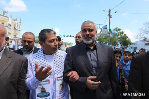 Palestinian Prime Minister in Gaza strip, Ismail Haniyeh, visits home former Ebrahim Baroud following his release from an Israeli jail after being detained for 27 years, at the Jabalyia refugee camp, in the northern Gaza...