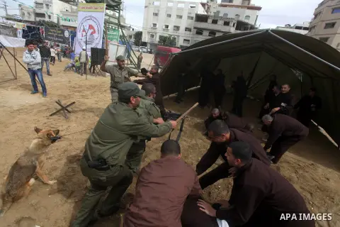 Palestinians men dressed in Israeli soldiers and prisoners uniforms are seen inside a prison in Gaza City that had been used by Israeli security services to keep Palestinian prisoners during Israel's occupation of Gaza S...